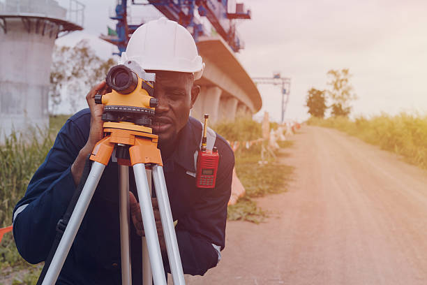 Surveyor with theodolite